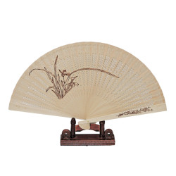 Wooden fan with punched...